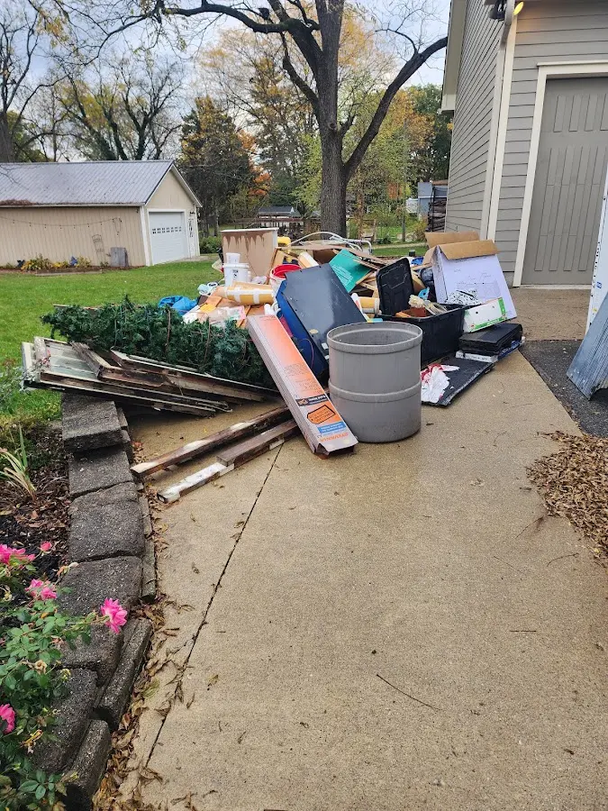 Dumpster being loaded with debris for Roofing Dumpster Rental in Ballenger Creek